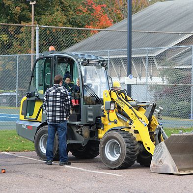 child sitting in stationary truck